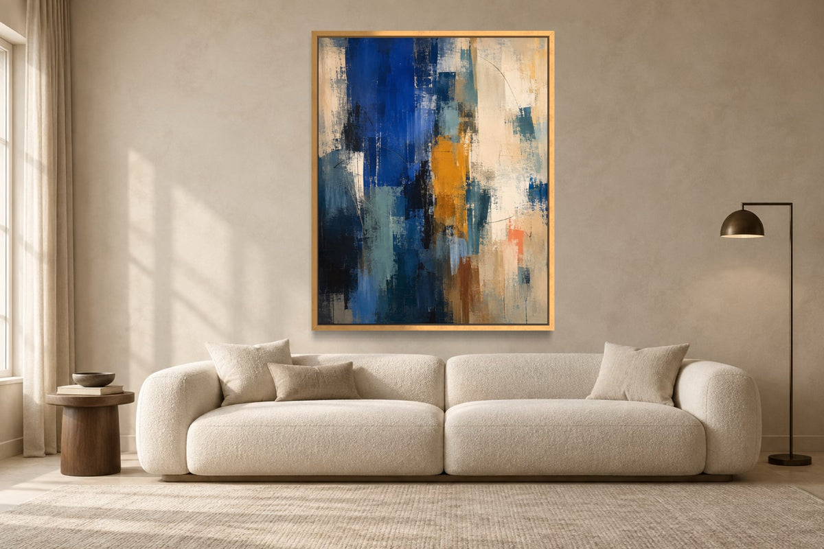 Cobalt Shift blue abstract wall art above an ivory sofa in a warm contemporary living room