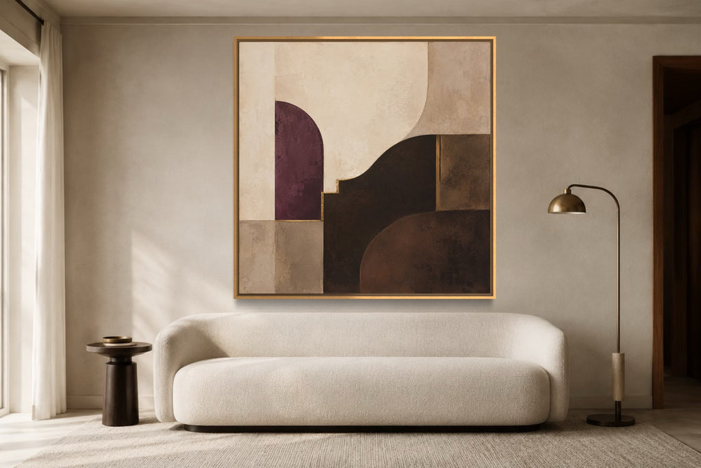 Plum Chamber square abstract wall art above a curved ivory sofa