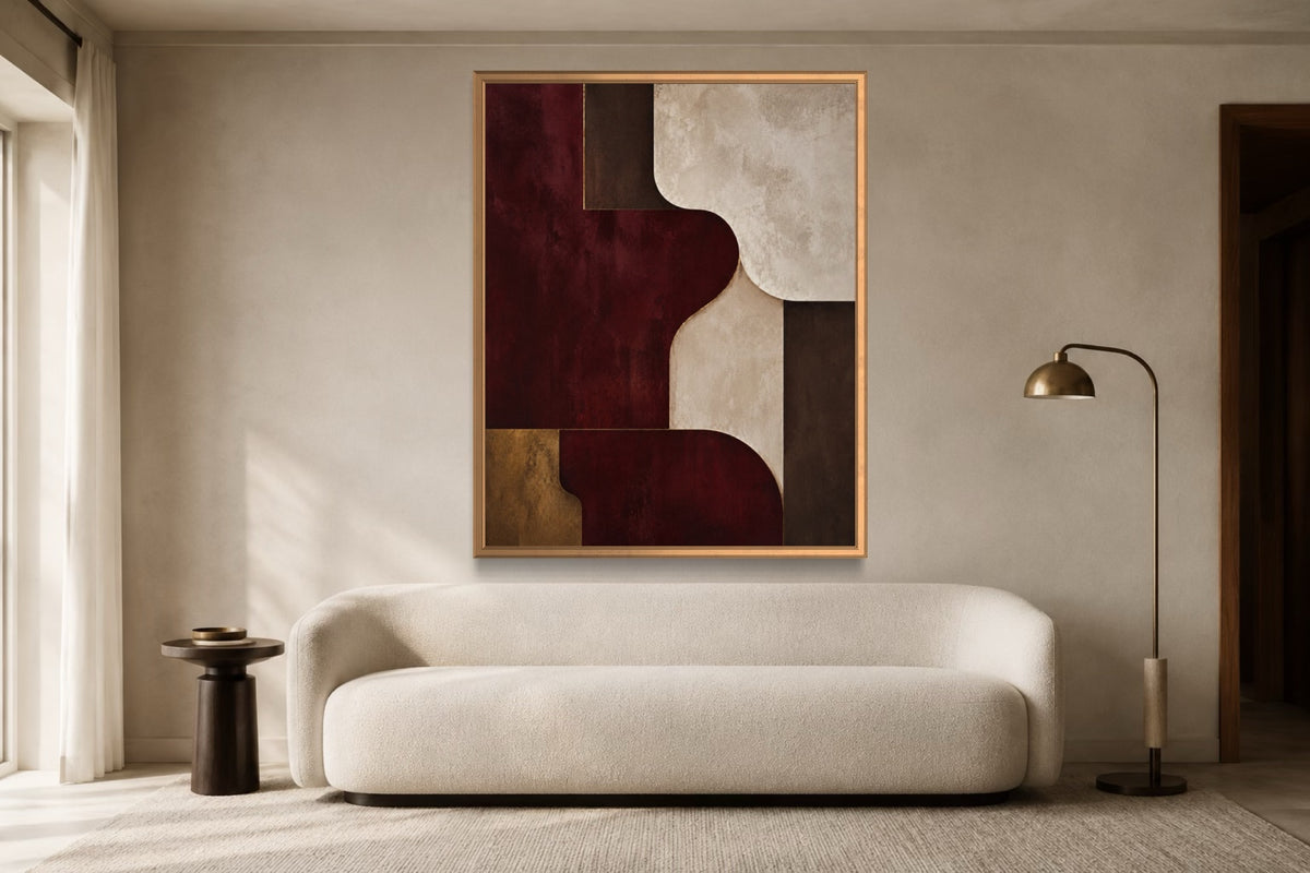 Burgundy Room oxblood geometric abstract wall art above an ivory sofa