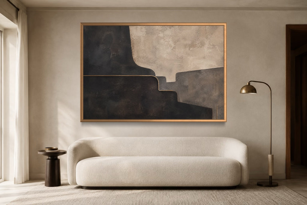 Midnight Form charcoal geometric abstract wall art above an ivory sofa