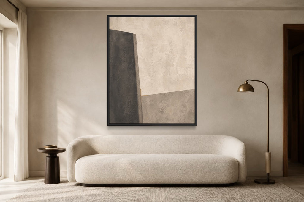 Midnight Interval light charcoal and limestone abstract wall art above an ivory sofa