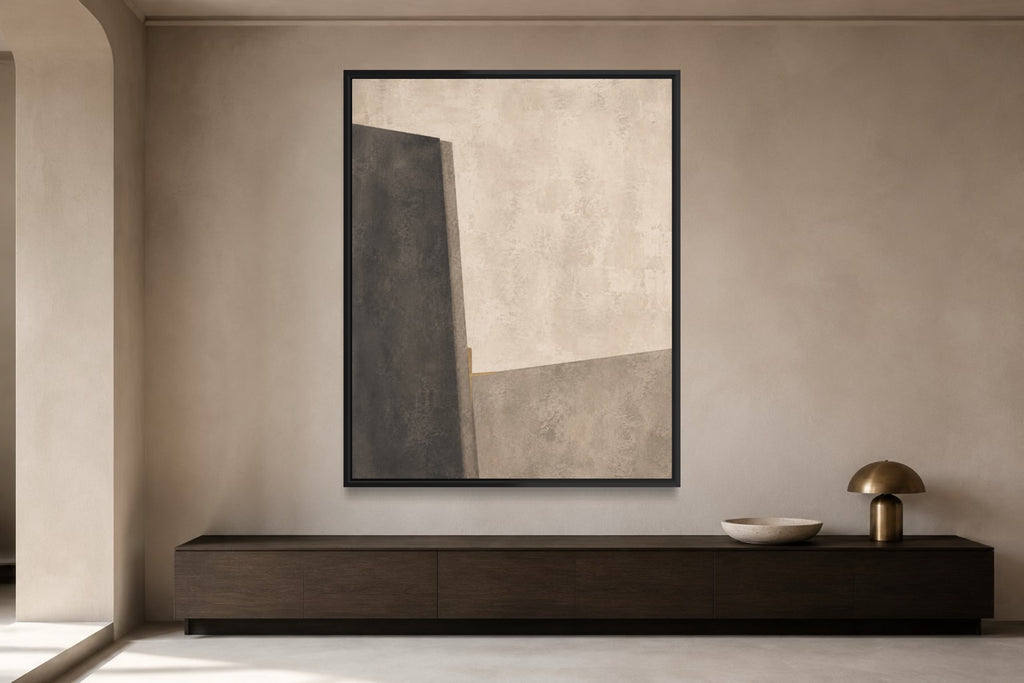 Midnight Interval limestone, graphite and stone abstract wall art above a dark timber console