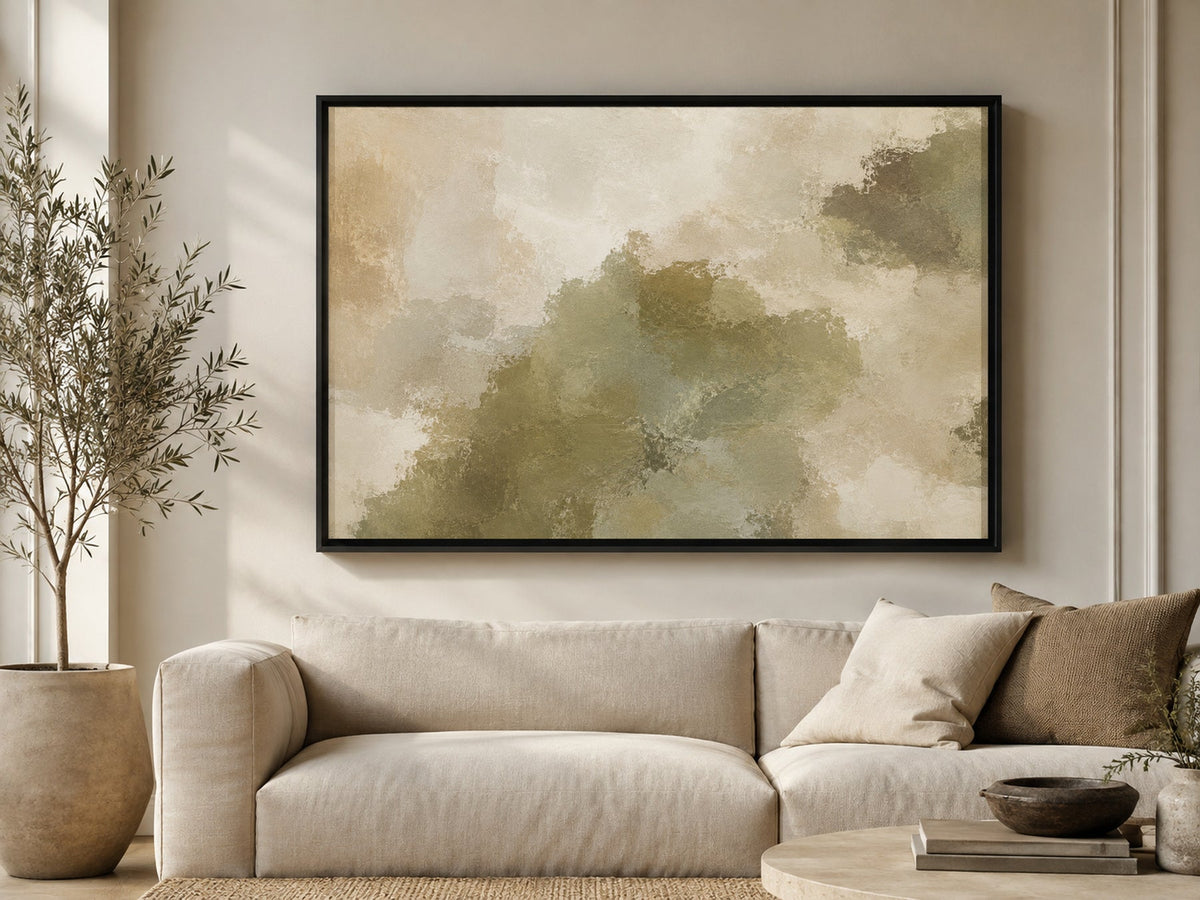 Olive Terrain olive green abstract wall art above a cream sofa in a warm organic living room